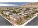 Aerial view of a neighborhood showcasing modern homes, landscaping, and mountain views at 6728 Regency Ridge Ct, Las Vegas, NV 89148