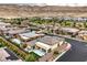 Overhead shot of a community with contemporary homes, green landscaping, and desert mountain scenery at 6728 Regency Ridge Ct, Las Vegas, NV 89148
