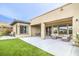 An outdoor oasis with a seating area, a manicured lawn, and a covered patio at 6728 Regency Ridge Ct, Las Vegas, NV 89148