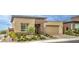 Inviting single-story house showcasing desert landscaping, neutral tones, and a brick driveway at 6728 Regency Ridge Ct, Las Vegas, NV 89148