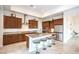 A modern kitchen featuring stainless steel appliances, stone countertops, and ample cabinetry at 6728 Regency Ridge Ct, Las Vegas, NV 89148