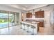 Modern kitchen featuring a breakfast bar, stainless steel appliances, and outdoor access at 6728 Regency Ridge Ct, Las Vegas, NV 89148
