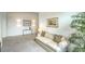 Inviting living room featuring a cream-colored sofa, art decorations, and modern lighting at 6728 Regency Ridge Ct, Las Vegas, NV 89148