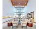 Spacious lobby area featuring high ceilings, modern decor, comfortable seating, and natural light at 6728 Regency Ridge Ct, Las Vegas, NV 89148
