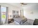 A comfortable bedroom with large windows, neutral decor, and ample natural light at 6728 Regency Ridge Ct, Las Vegas, NV 89148