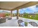 A covered outdoor living space featuring a table and chairs and lounge seating at 6728 Regency Ridge Ct, Las Vegas, NV 89148
