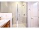 Shower with glass doors and bench at 6728 Regency Ridge Ct, Las Vegas, NV 89148
