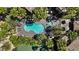 Aerial view of the community pool nestled among lush palm trees and meticulously maintained landscaping at 7119 S Durango Dr # 211, Las Vegas, NV 89113