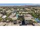 Community aerial view showcasing well-maintained buildings, palm trees, tennis court, and tile roofs at 7119 S Durango Dr # 211, Las Vegas, NV 89113