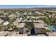 Community aerial view showcasing well-maintained buildings, palm trees, tennis court, and tile roofs at 7119 S Durango Dr # 211, Las Vegas, NV 89113