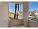 Balcony view showcasing palm trees and surrounding buildings for a relaxing outdoor space at 7119 S Durango Dr # 211, Las Vegas, NV 89113