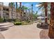 Inviting community area with lush landscaping, picnic tables, and access to a pool at 7119 S Durango Dr # 211, Las Vegas, NV 89113