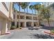 Exterior of condo building showing well maintained landscaping, covered entries and garages at 7119 S Durango Dr # 211, Las Vegas, NV 89113