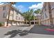 Exterior view of condo units with garages, showcasing a well-maintained community at 7119 S Durango Dr # 211, Las Vegas, NV 89113