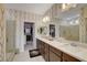 The bathroom is complete with a large countertop, stylish wallpaper, and walk-in closet at 7208 Grace Estate Ave, Las Vegas, NV 89113