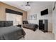 Inviting bedroom featuring two beds, dark furniture and a modern style, providing a stylish and functional space at 7208 Grace Estate Ave, Las Vegas, NV 89113