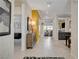 Elegant hallway featuring neutral walls, tile flooring, and view to the open floor plan at 7208 Grace Estate Ave, Las Vegas, NV 89113