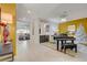 Open living area with elegant decor, including a piano, a bar, and views to the outside at 7208 Grace Estate Ave, Las Vegas, NV 89113