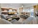 Open-concept living space featuring a modern kitchen and a comfortable living area with stylish decor at 7208 Grace Estate Ave, Las Vegas, NV 89113