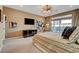 Bright main bedroom boasts a king-size bed, neutral tones, and large windows with a view of the backyard patio at 7208 Grace Estate Ave, Las Vegas, NV 89113