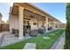 Extended covered patio featuring comfortable seating and dining area perfect for outdoor living at 7208 Grace Estate Ave, Las Vegas, NV 89113
