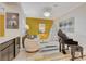 Elegant sitting area with a piano, artwork, and comfortable seating at 7208 Grace Estate Ave, Las Vegas, NV 89113