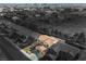 Aerial view of a home in a neighborhood highlighting the pool and outdoor kitchen at 7466 Matilda St, Las Vegas, NV 89113