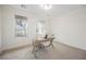 Bright home office featuring neutral paint, carpet flooring, and a wood desk at 7466 Matilda St, Las Vegas, NV 89113