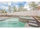 Backyard pool and spa with waterfall feature and well-kept landscaping at 7466 Matilda St, Las Vegas, NV 89113
