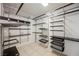 Walk-in closet with shelving, drawers, and ample storage space at 7466 Matilda St, Las Vegas, NV 89113