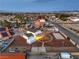 Expansive aerial view of a home featuring a large lot, detached garage, and neighborhood views at 7477 Ullom Dr, Las Vegas, NV 89139