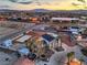 Aerial view showcases the property's layout, including the home, surroundings, and location in the neighborhood at 7477 Ullom Dr, Las Vegas, NV 89139