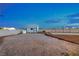 Backyard featuring a shed and block wall at 7477 Ullom Dr, Las Vegas, NV 89139