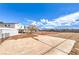 Large backyard with spacious area and mature tree, offers ample space for outdoor activities at 7477 Ullom Dr, Las Vegas, NV 89139