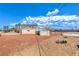 Backyard featuring a detached garage or shed and chainlink fencing at 7477 Ullom Dr, Las Vegas, NV 89139