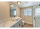 Bathroom featuring new sink and faucet with tiled glass-enclosed shower for a clean, spa-like feel at 7477 Ullom Dr, Las Vegas, NV 89139