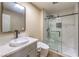 Contemporary bathroom with marble walk-in shower, stylish vanity, and modern toilet at 7477 Ullom Dr, Las Vegas, NV 89139