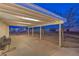 Spacious covered patio with lighting and view of the backyard at 7477 Ullom Dr, Las Vegas, NV 89139