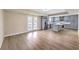 Open kitchen with stainless appliances, grey cabinets, a kitchen island and a door to the yard at 7477 Ullom Dr, Las Vegas, NV 89139
