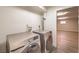 The laundry room features a Samsung washer and dryer, plus access to a large bonus room at 7477 Ullom Dr, Las Vegas, NV 89139