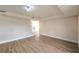 Hardwood floors in a living room featuring a staircase and unique overhead lighting at 7477 Ullom Dr, Las Vegas, NV 89139