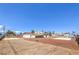 Wide lot with the main house featuring two stories and well defined yard spaces at 7477 Ullom Dr, Las Vegas, NV 89139
