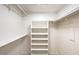 Bright, organized walk-in closet with shelving and hanging rods for optimal storage solutions at 7477 Ullom Dr, Las Vegas, NV 89139