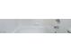 A close-up view shows a bathtub with white tile walls and silver hardware at 7857 Midnight Ride St, Las Vegas, NV 89131