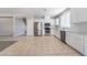 Spacious open-concept kitchen with stainless steel appliances and tile flooring at 7857 Midnight Ride St, Las Vegas, NV 89131