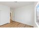 Bright, spacious bedroom with a closet and natural light from a large window at 7936 Pinnochio Ave, Las Vegas, NV 89131