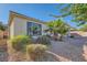 Desert landscaping with a covered patio on the back of the home at 8305 Chapelle Ct, Las Vegas, NV 89131
