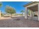 Low-maintenance backyard with gravel, landscaping and a covered patio at 8305 Chapelle Ct, Las Vegas, NV 89131