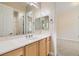 Well-lit bathroom featuring a single vanity, mirror, and a separate door to the toilet and shower area at 8305 Chapelle Ct, Las Vegas, NV 89131