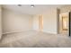 Spacious bedroom with neutral walls, soft carpet, and ample natural light streaming through the windows at 8305 Chapelle Ct, Las Vegas, NV 89131